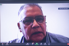 Reunião sobre política municipal para a população migrante.